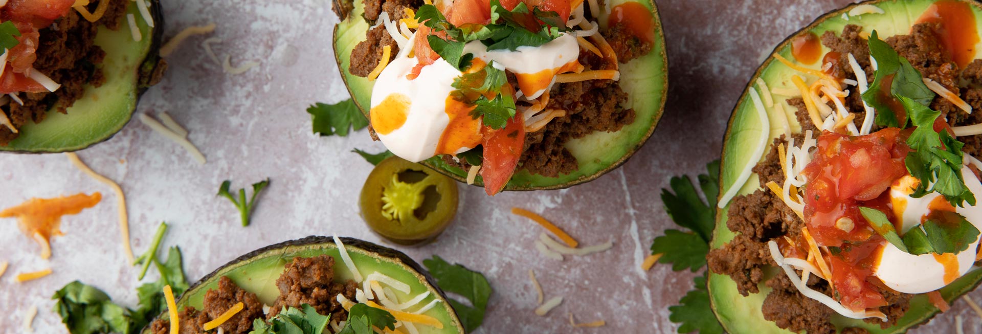 Taco Stuffed Avocados with Spicy Sour Cream